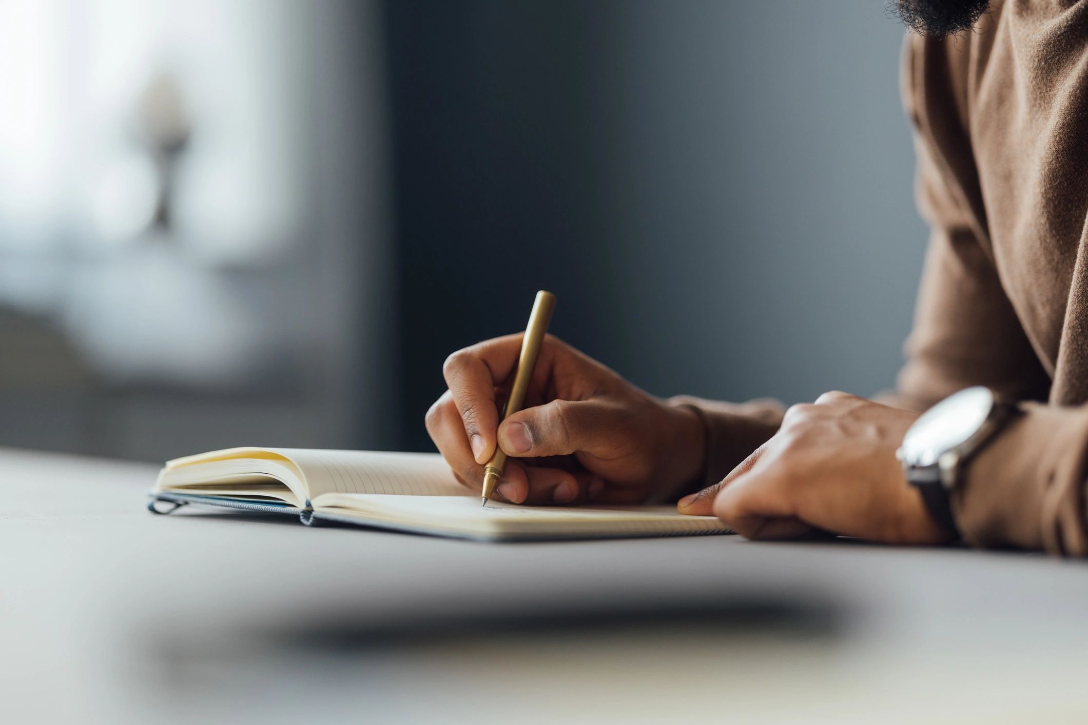 author writing at desk